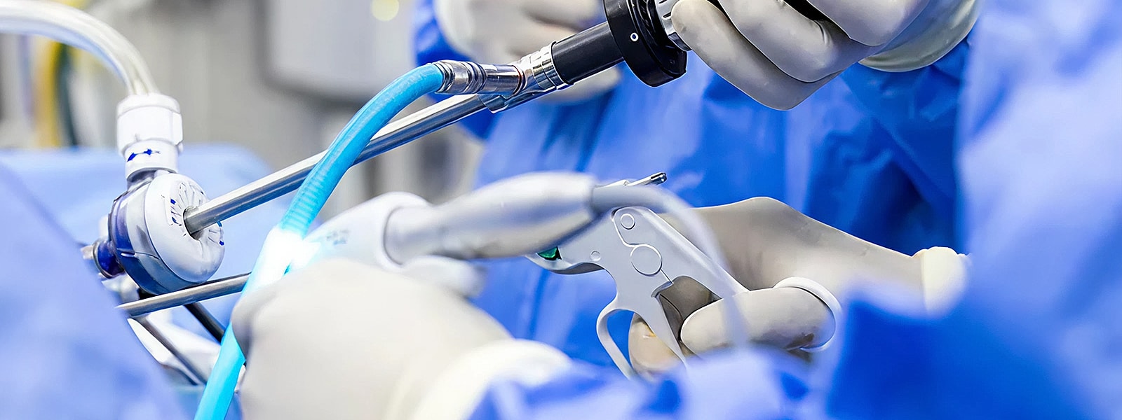 Lancaster orthopedic surgeons using medical instruments in operating room.