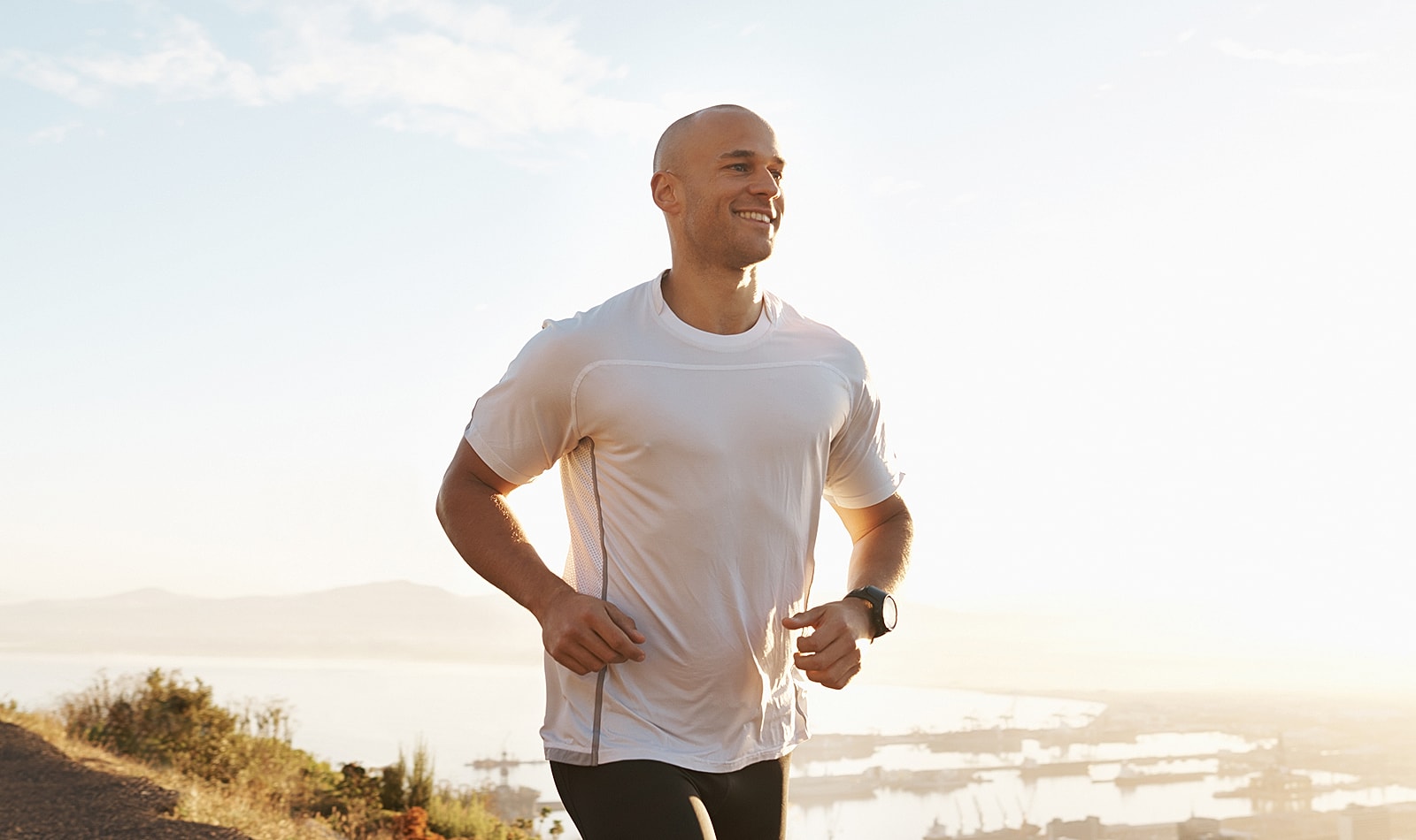 Lancaster orthopedic surgery man jogging outdoors with a scenic background.